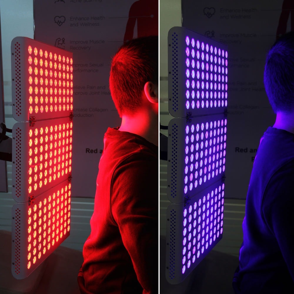 man using red and blue light therapy panel